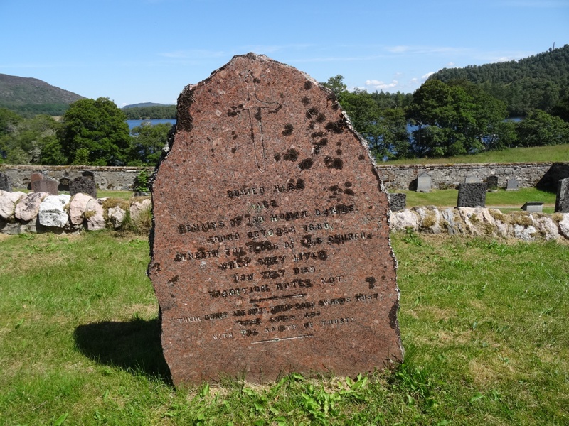 Red Granite Gravestone marking site of mass burial of 150 bodies at Alvie Kirk.