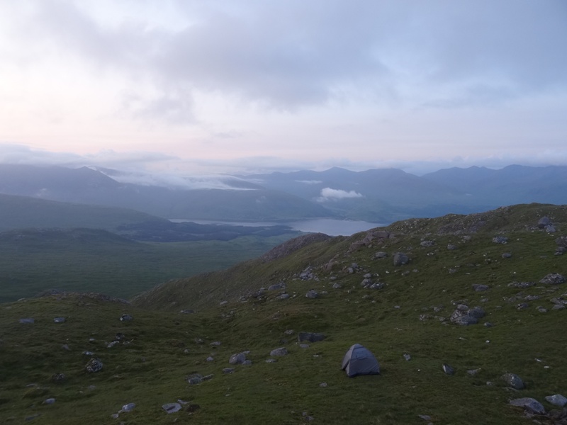 Camping in a tent on a Scottish Mountain