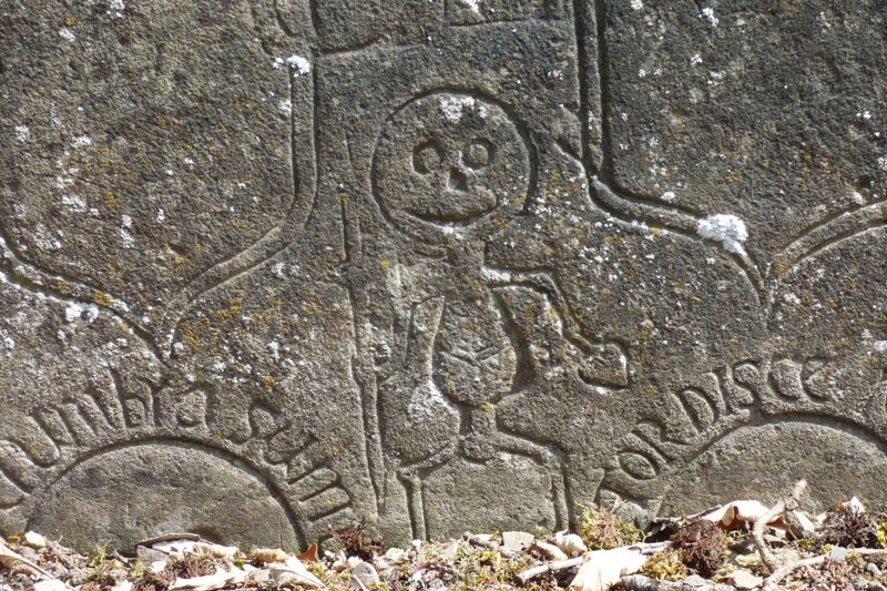 Detail from an old Aberlemno gravestone showing a skeleton figure 