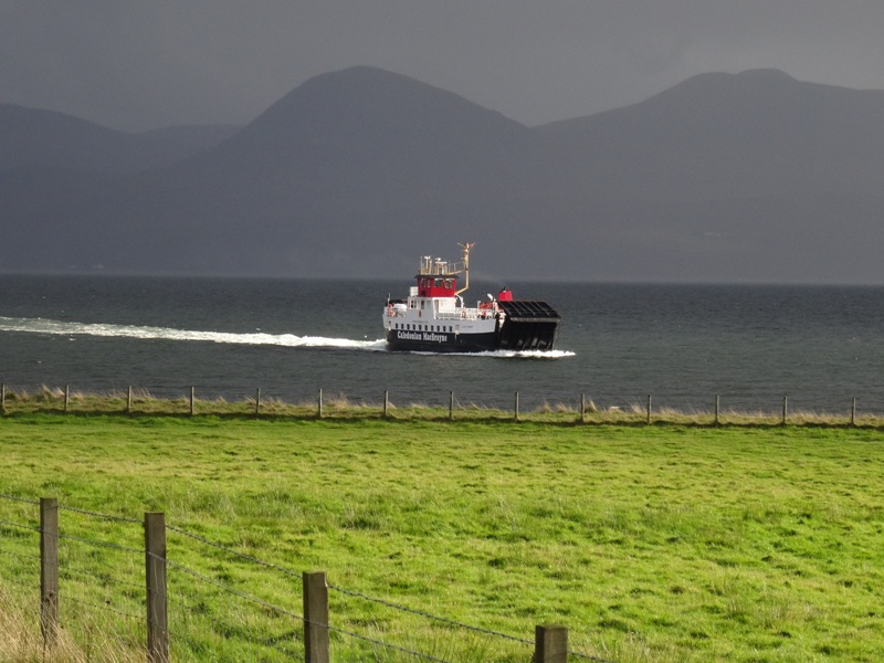 Ferry arriving at Claonaig with mixed weather