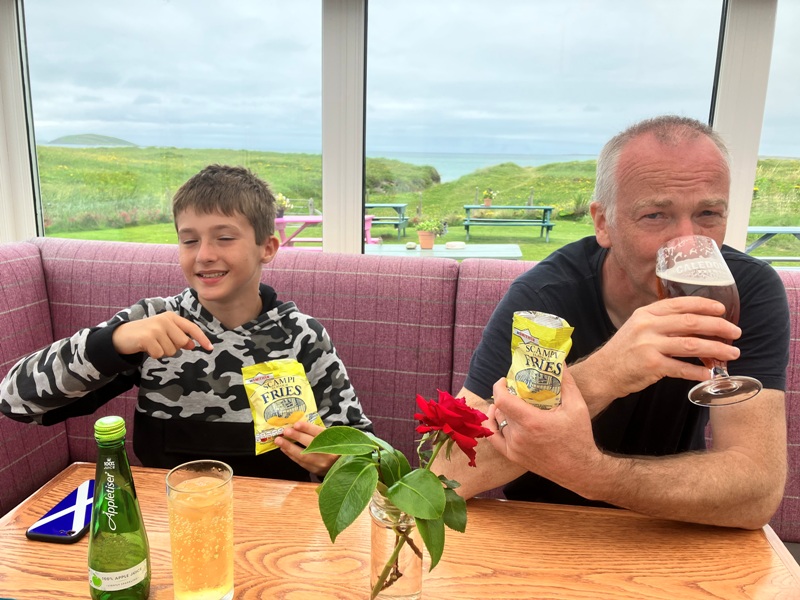 Enjoying a Beer and a packet of crisps at Am Politician bar on Eriskay