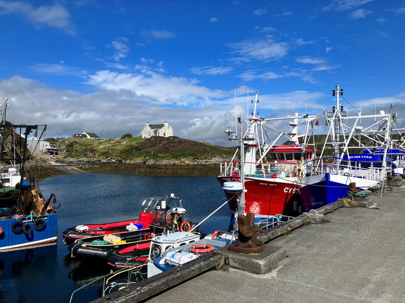 Colourful fishing boats in Kallin Harbour on Grimsay