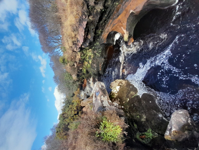 Unusual rock formations in red sandstone on Machrie Water river.