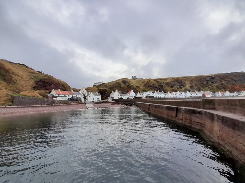 Pennan viewed from the harbour breakwater