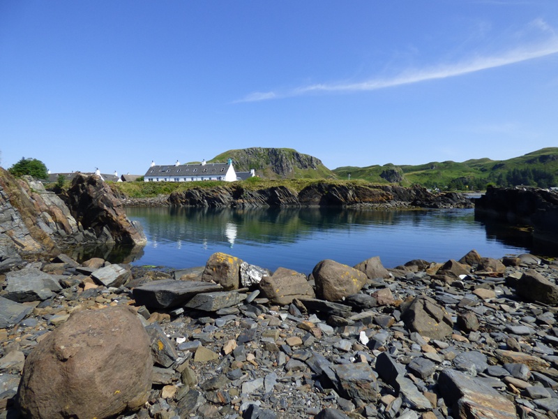 Cottages and an old flooded slate quarry on Easdale