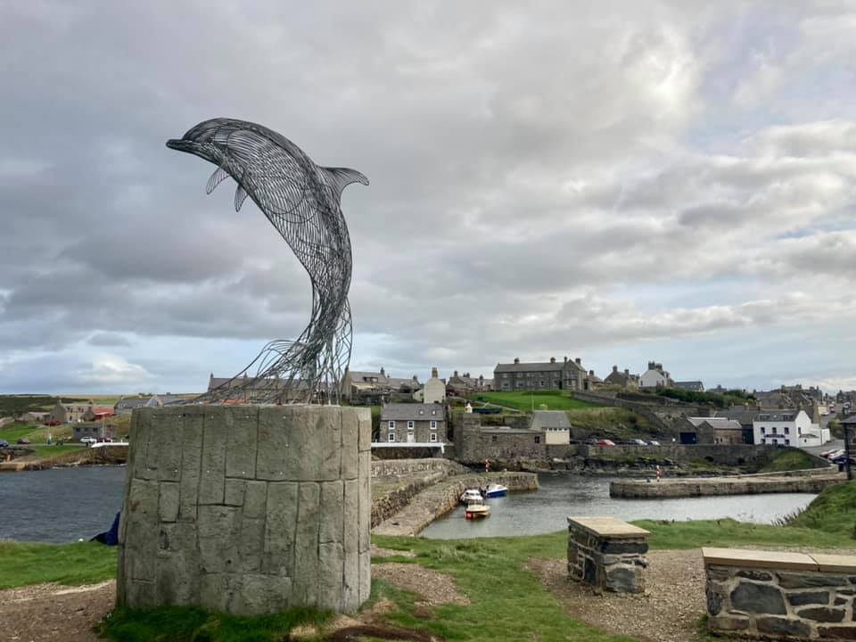 Dolphin sculpture Artwork beside Portsoy Harbour