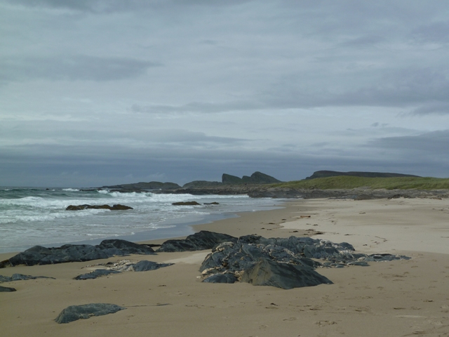 Waves hit the beach at Saligo Bay