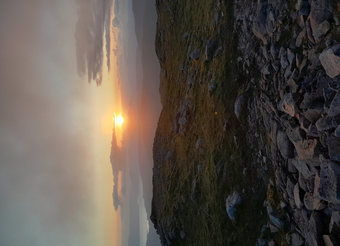 Sunset view from a Scottish Mountain on the Summer Solstice