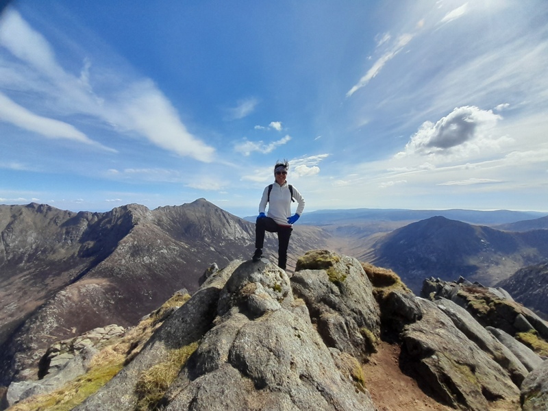 Standing on the pointed summit of Cir Mhor