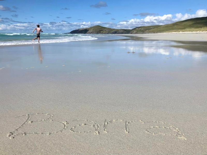 Running barefoot on a beach on Barra