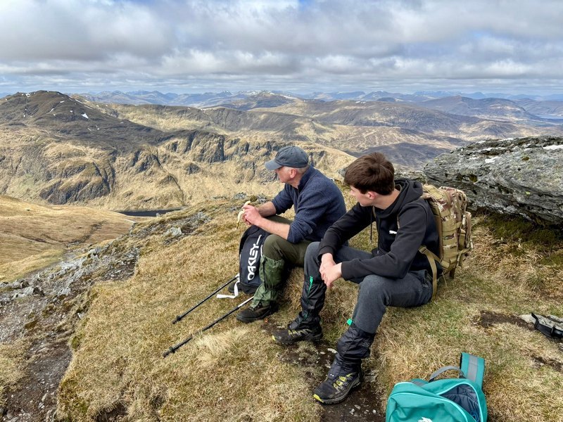 Hikers on a quiet Munro in Scotland Hikers on a quiet Munro in Scotland
