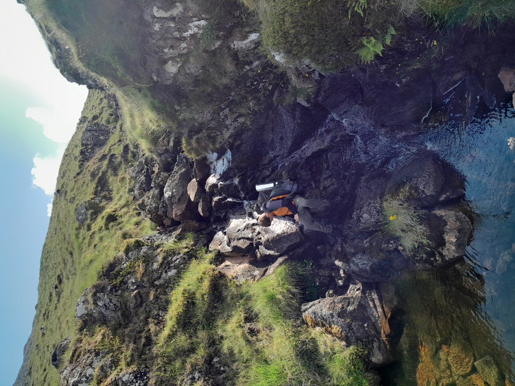 Freshening up in a Scottish mountain stream at dawn